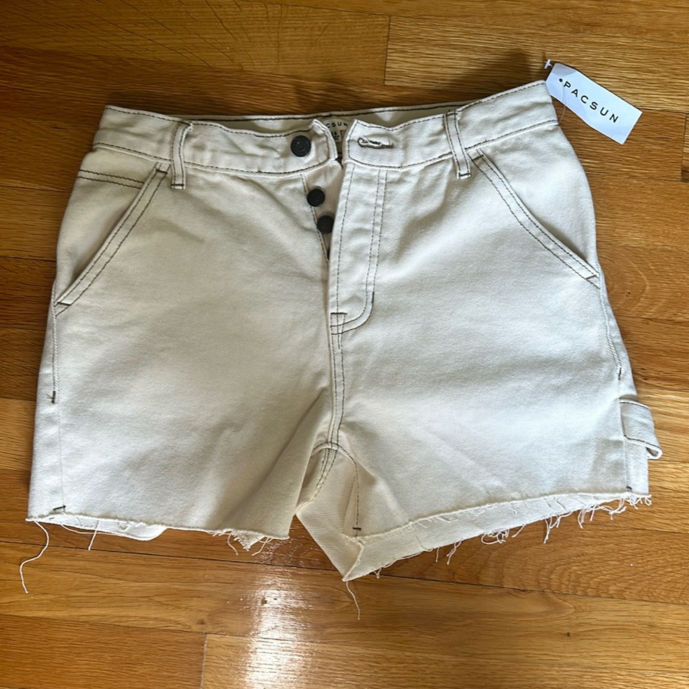 Pacsun off white Jean shorts with brown stitching. Size 25